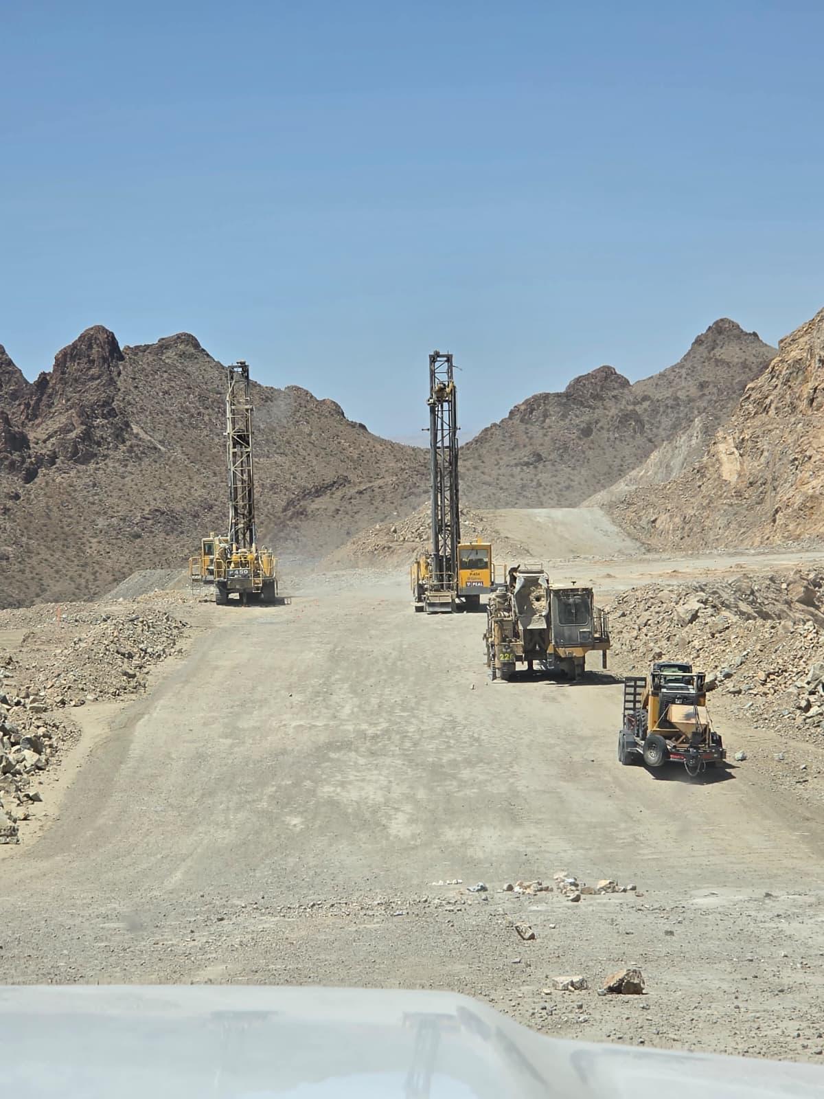 Dual drill rigs on haul road