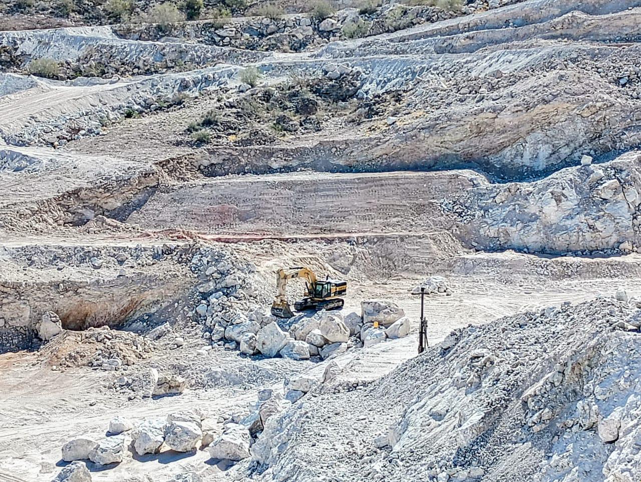 Excavator at open-pit face