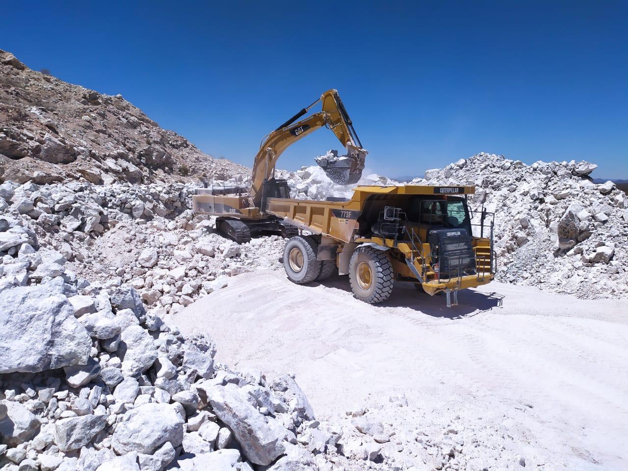 Excavator loading dump truck